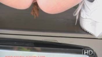 Female urinating and defecating on a vintage television